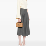 Tan bags worn by a person, showing the bags's fit
