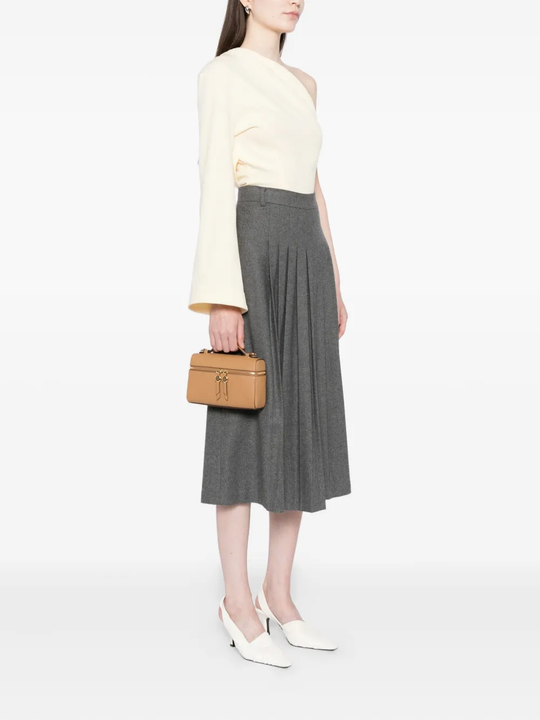 Tan bags worn by a person, showing the bags's fit
