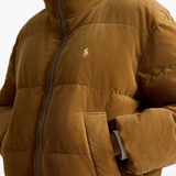 Tan jacket worn by a person, showing the jacket fit
