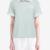 Green t-shirt worn by a person, showing the t-shirt fit