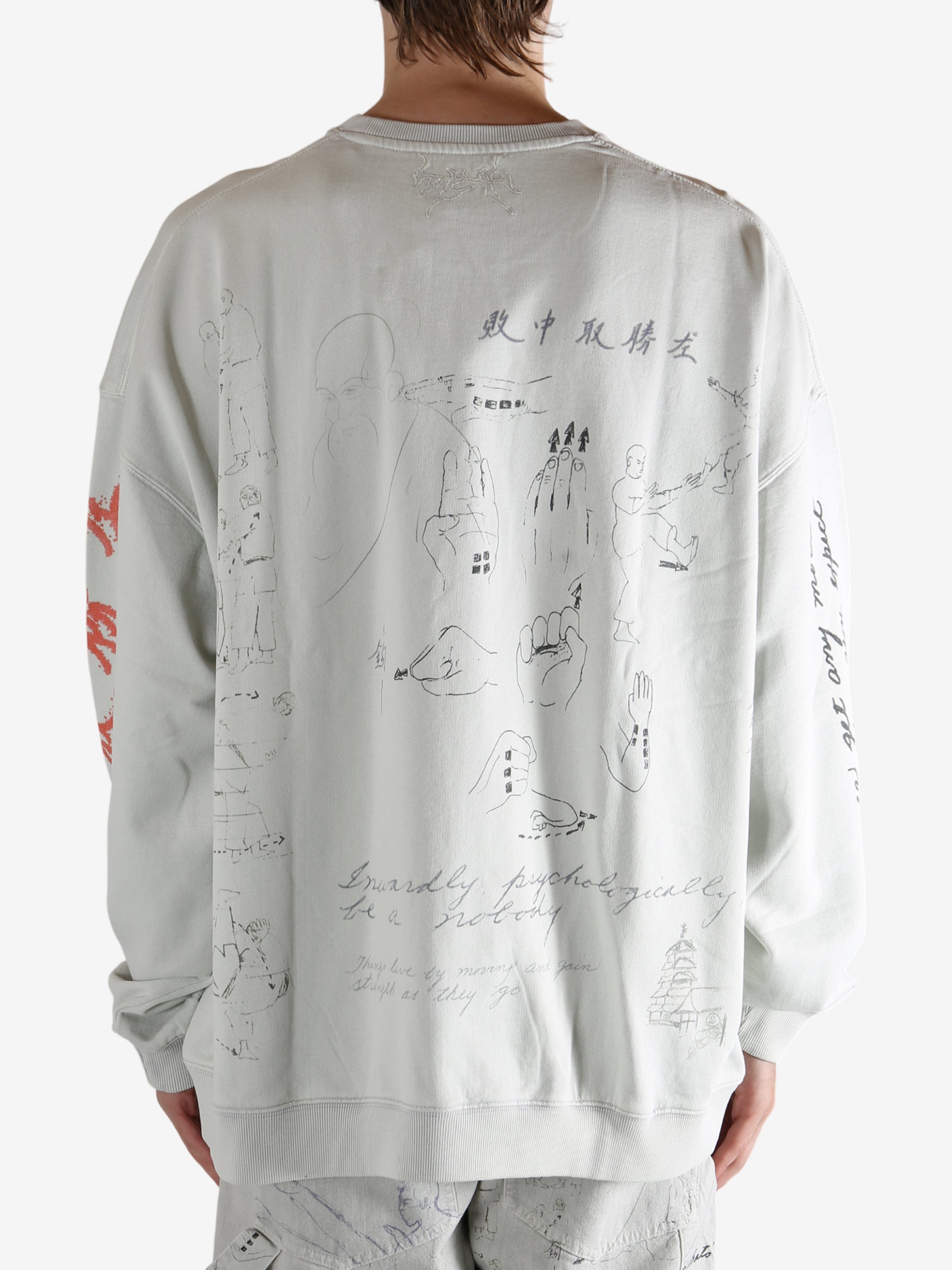 Grey top worn by a person, showing the top fit