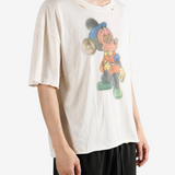 Tan t-shirt worn by a person, showing the t-shirt fit