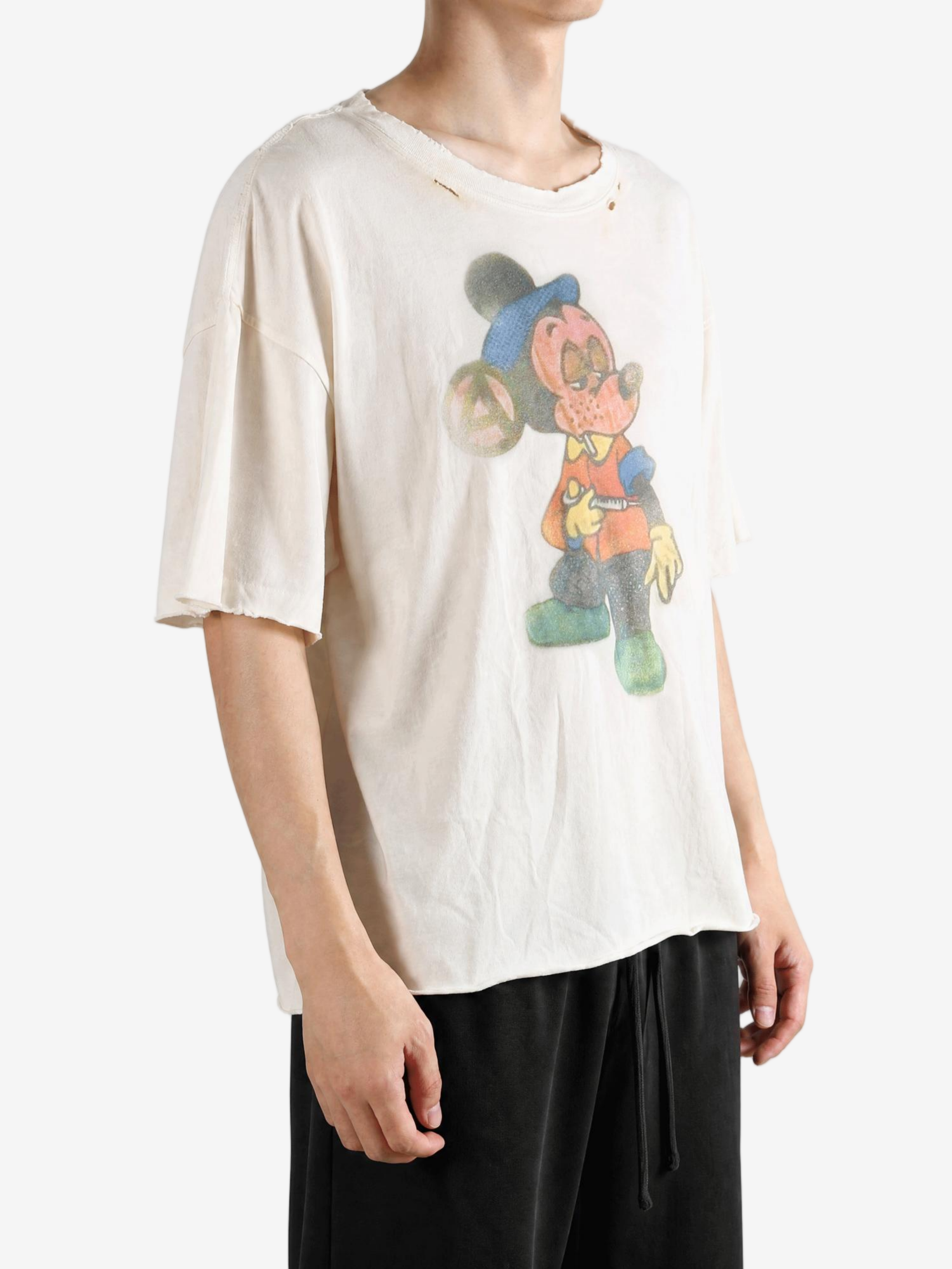 Tan t-shirt worn by a person, showing the t-shirt fit
