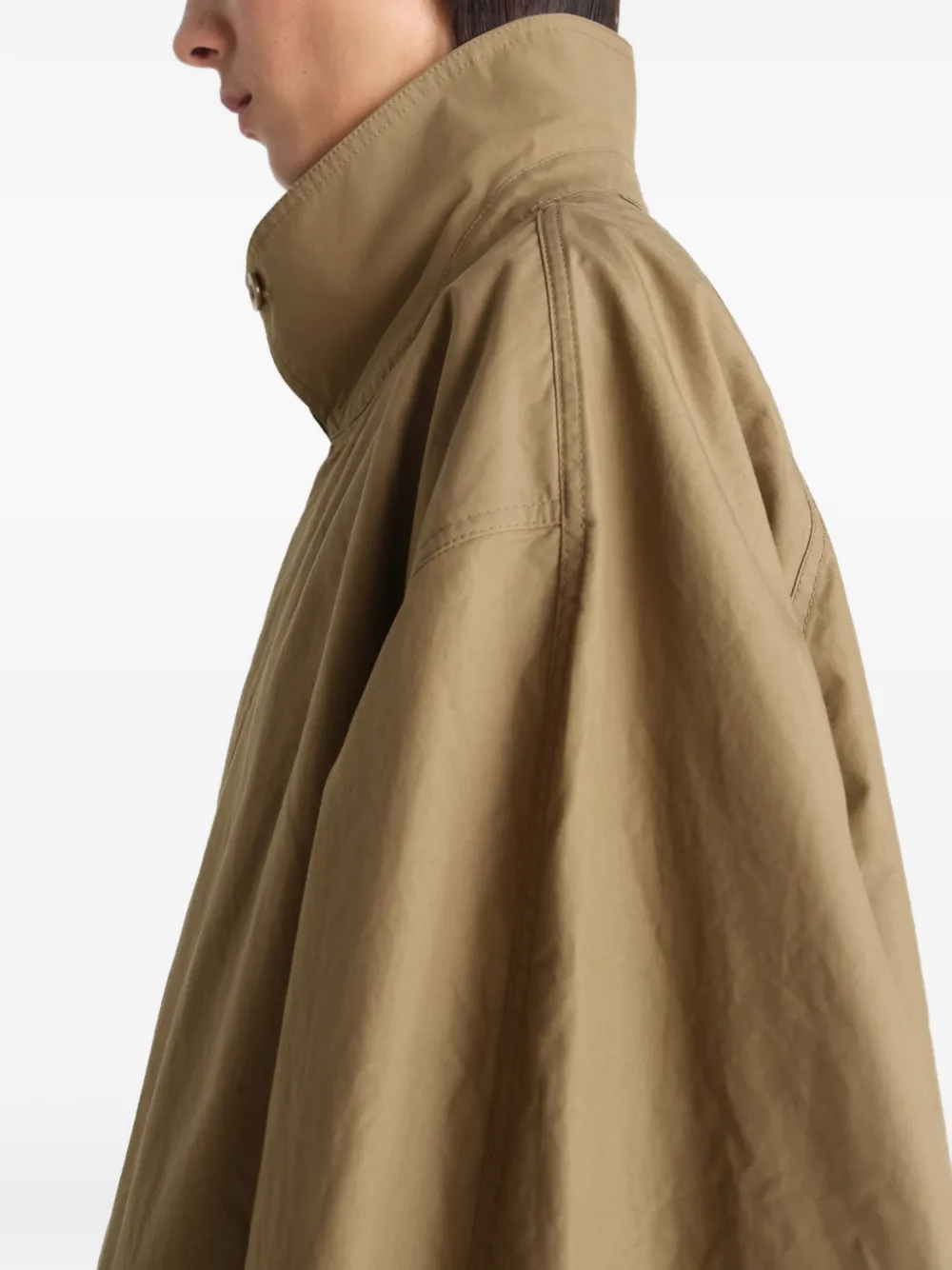 Close up of tan jacket, showing texture of the cotton fabric
