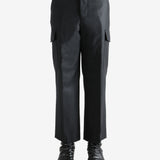 Black pant worn by a person, showing the pant's fit