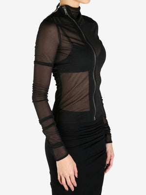 Black coat worn by a person, showing the coat's fit