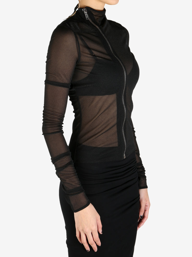 Black coat worn by a person, showing the coat's fit