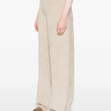 Tan pants worn by a person, showing the pants fit