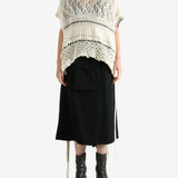 White vests worn by a person, showing the vests fit