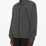 Black shirts worn by a person, showing the shirts fit