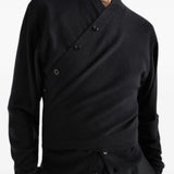 Black top worn by a person, showing the top fit
