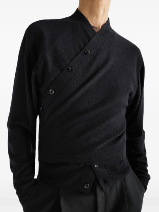Black top worn by a person, showing the top fit