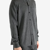 Grey shirt worn by a person, showing the shirt's fit