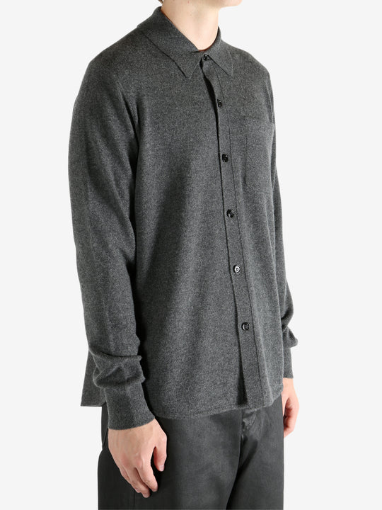 Grey shirt worn by a person, showing the shirt's fit