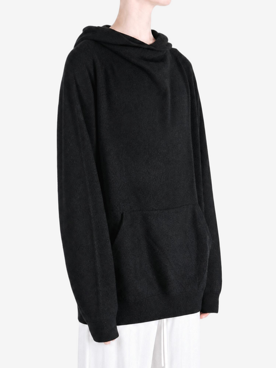 Black hoodie worn by a person, showing the hoodie fit