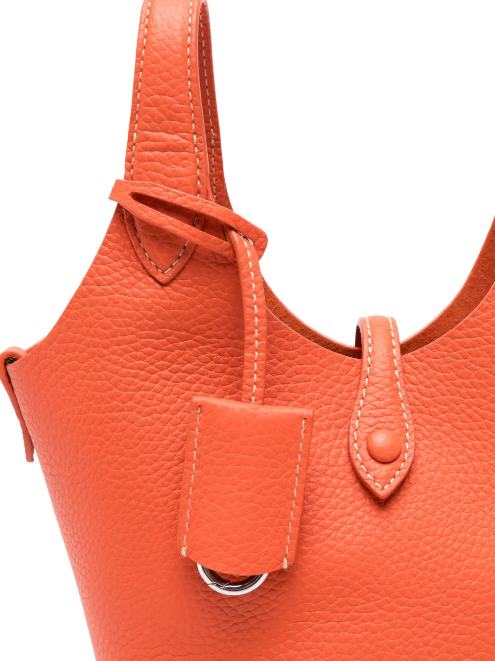 Close up of orange bag, showing texture of the calf leather fabric