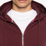 Close up of red hoodies, showing texture of the cotton fabric