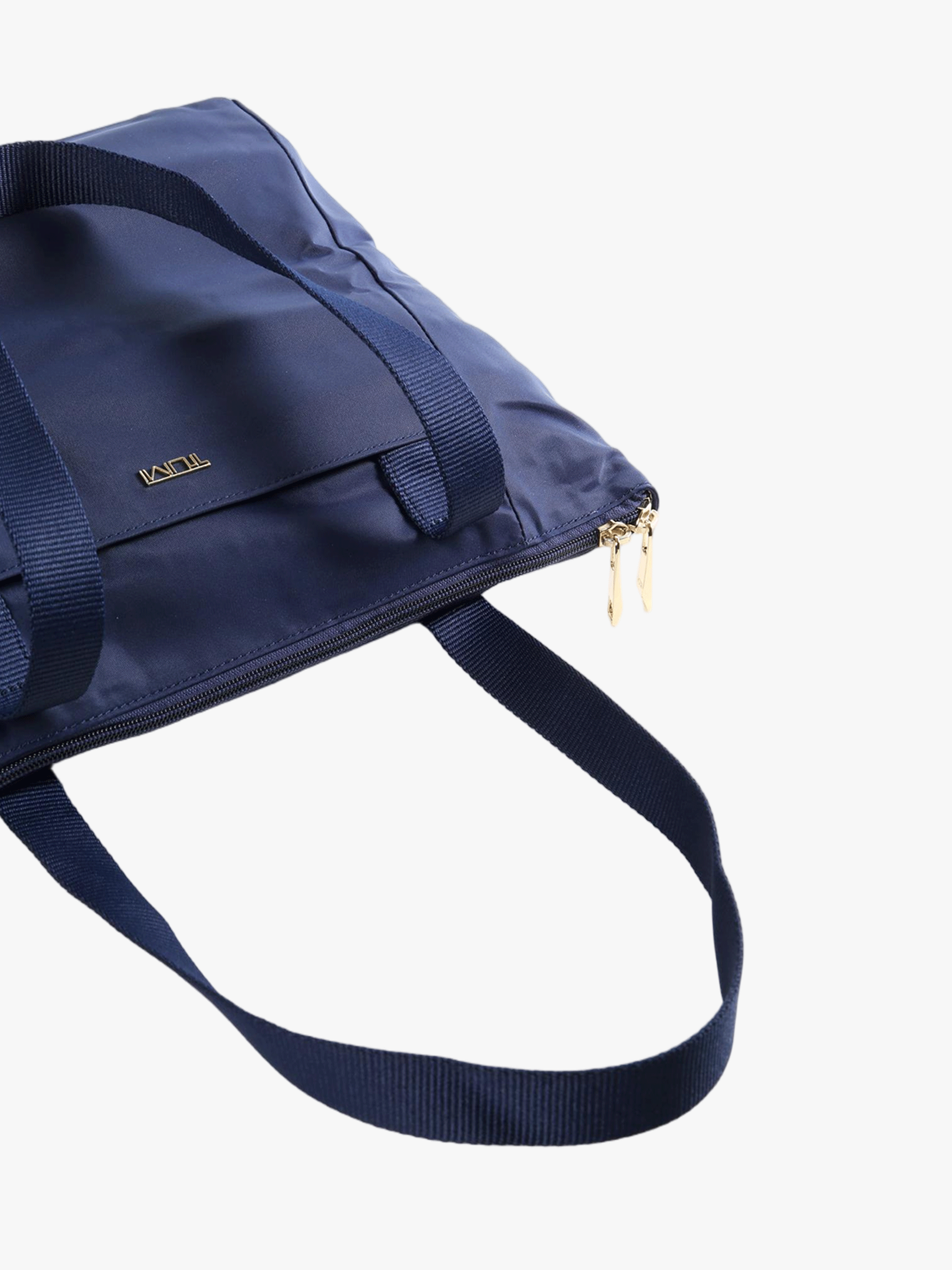 Close up of navy bag, showing texture of the Nylon fabric
