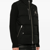 Black jacket worn by a person, showing the jacket fit