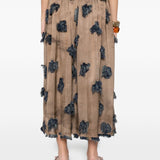 Brown skirt worn by a person, showing the skirt's fit