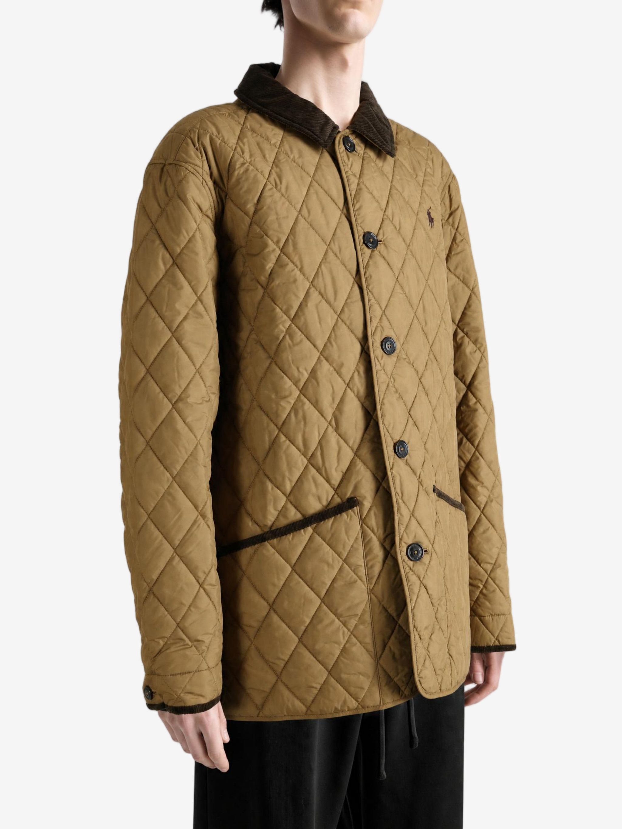 Tan jacket worn by a person, showing the jacket fit