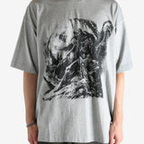 Grey t-shirt worn by a person, showing the shirt's fit