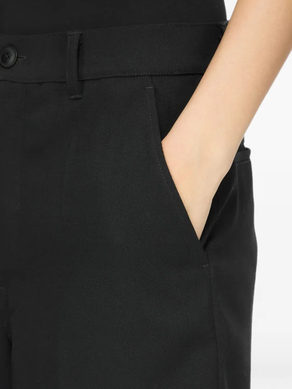 Black shorts worn by a person, showing the shorts fit