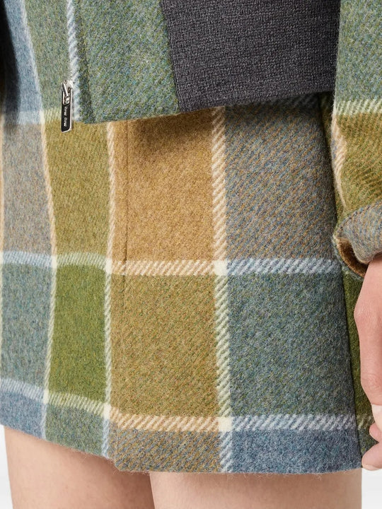 Close up of tan jackets, showing texture of the virgin wool fabric