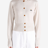 Tan knitwear worn by a person, showing the knitwear fit