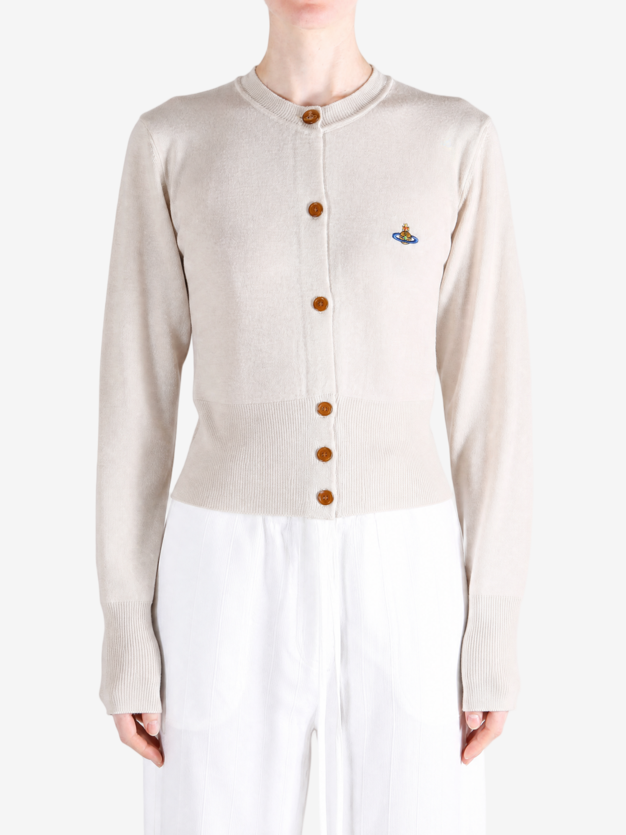 Tan knitwear worn by a person, showing the knitwear fit