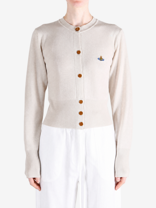 Tan knitwear worn by a person, showing the knitwear fit