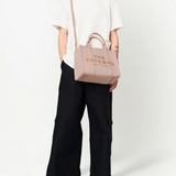 Pink bags worn by a person, showing the bags fit