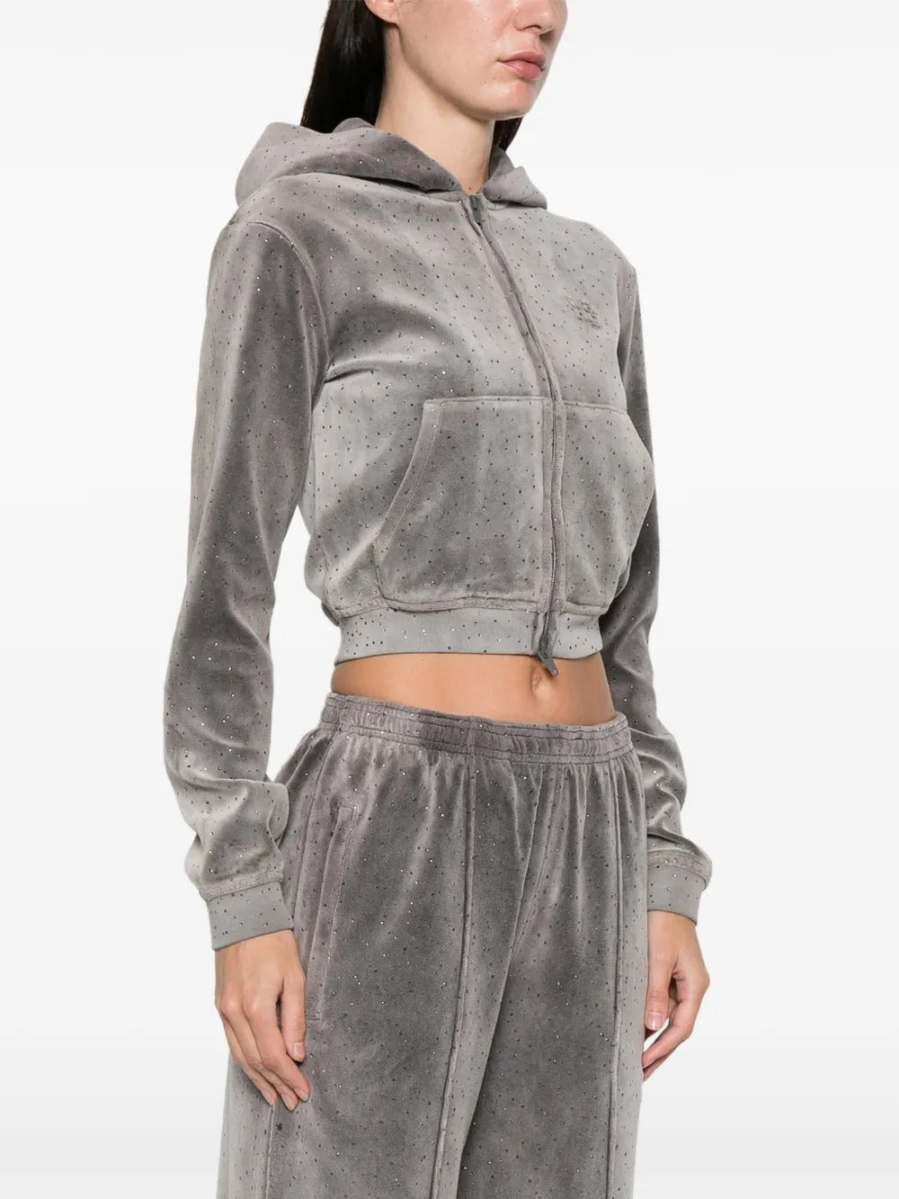 Grey hoodie worn by a person, showing the hoodie's fit