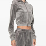 Grey hoodie worn by a person, showing the hoodie's fit