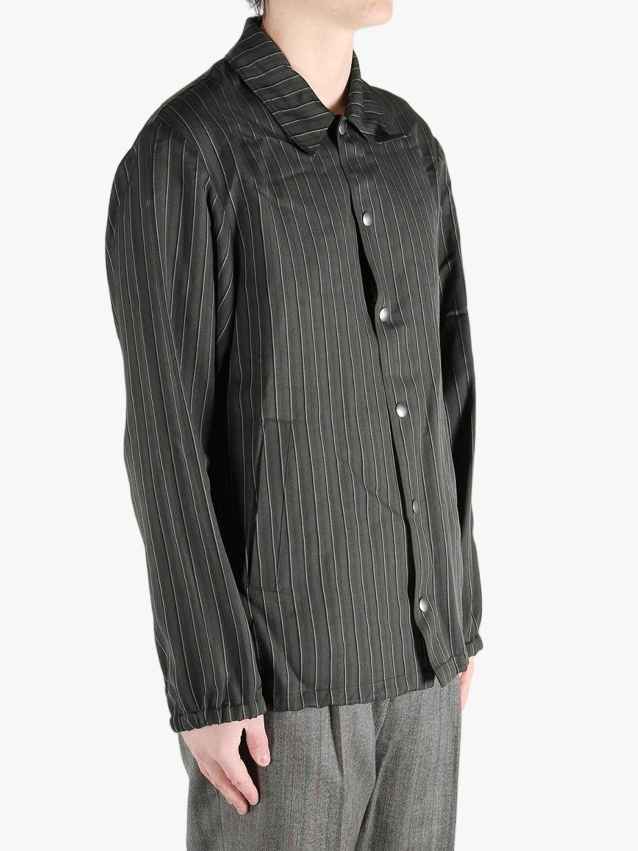 Black jackets-coats worn by a person, showing the jackets-coats'fit