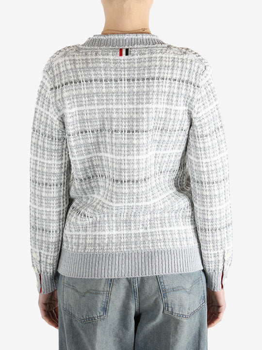 Grey knitwear worn by a person, showing the cotton fit