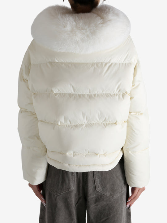 White jacket worn by a person, showing the jacket's fit