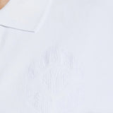 Close up of the white t-shirt, showing texture of the cotton fabric