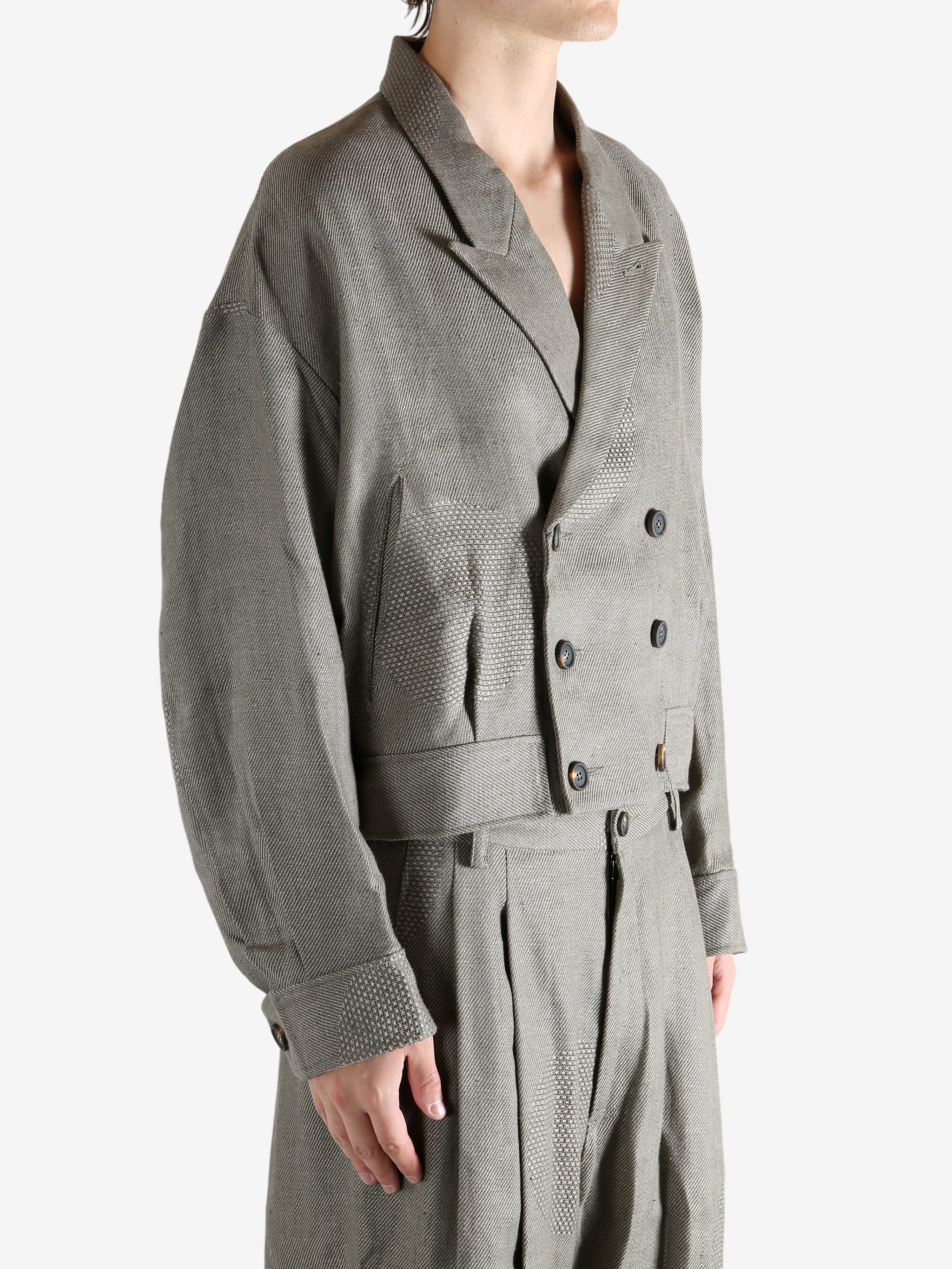 Grey jacket worn by a person, showing the jacket's fit