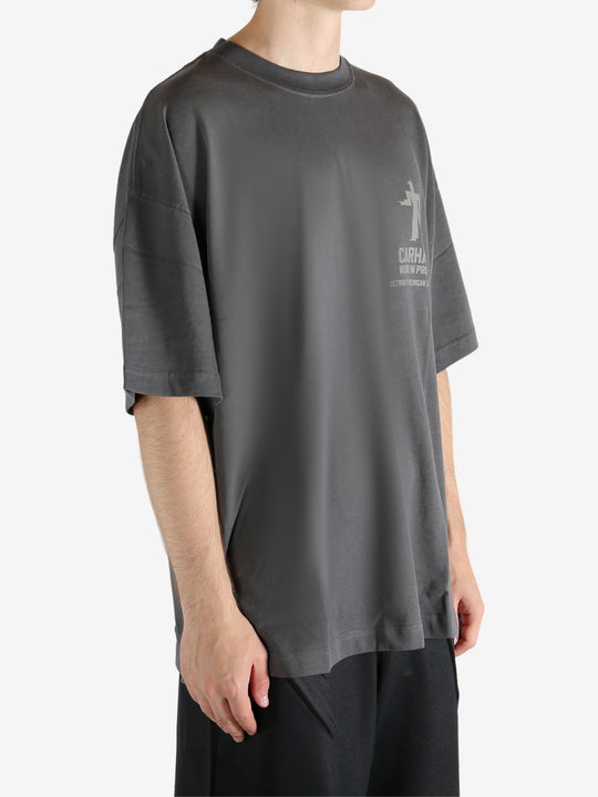 Grey t-shirt worn by a person, showing the t-shirt's fit