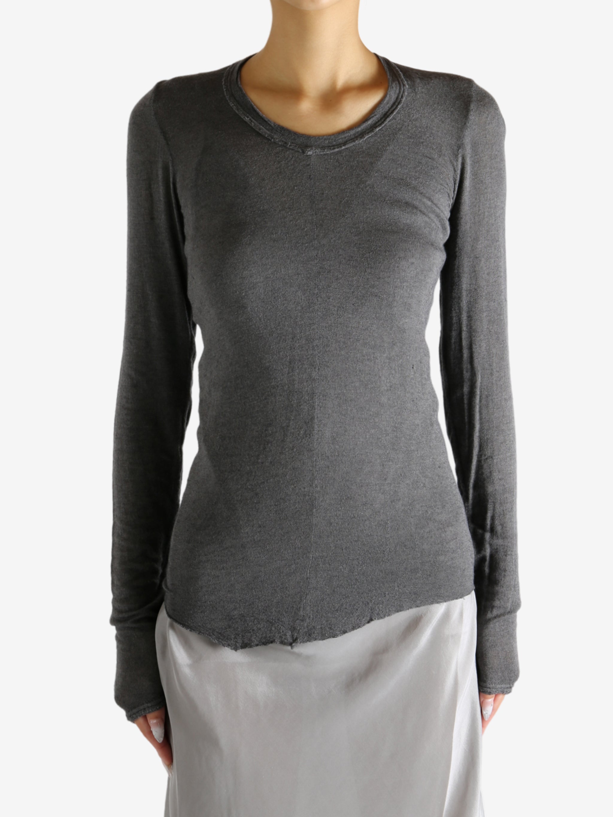 Grey t-shirt worn by a person, showing the shirt's fit