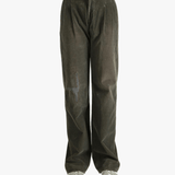 Brown pants worn by a person, showing the pants' fit