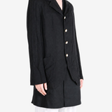 Black jacket worn by a person, showing the jacket fit