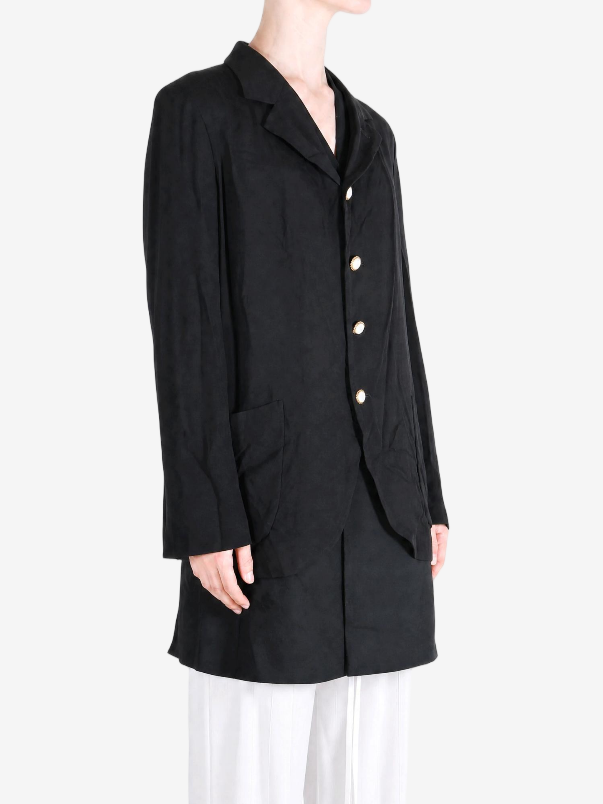 Black jacket worn by a person, showing the jacket fit