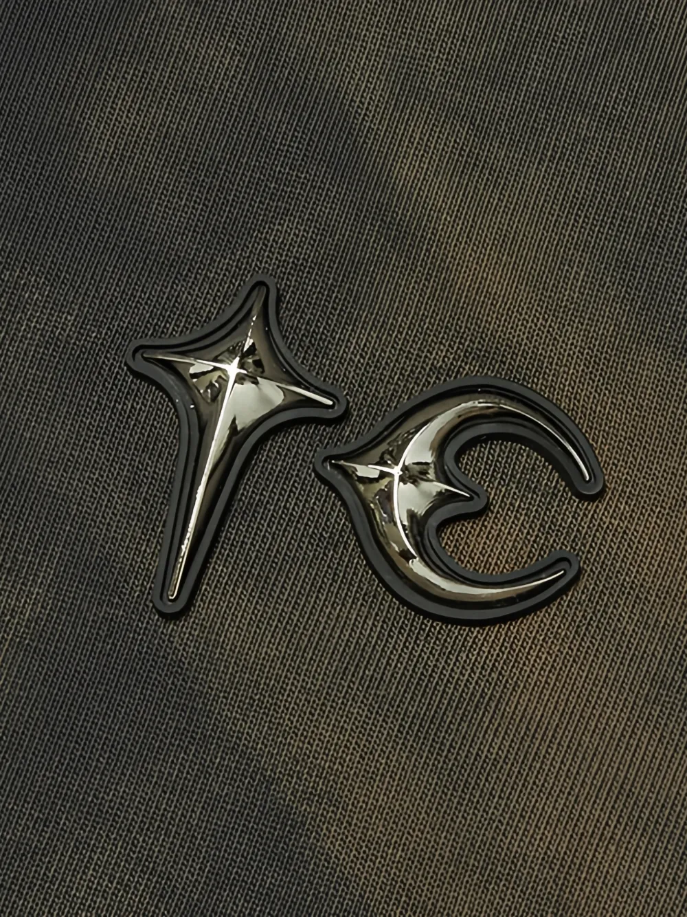 Close up of black hoodie, showing texture of the Cotton fabric