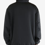 Black jacket worn by a person, showing the jacket's fit