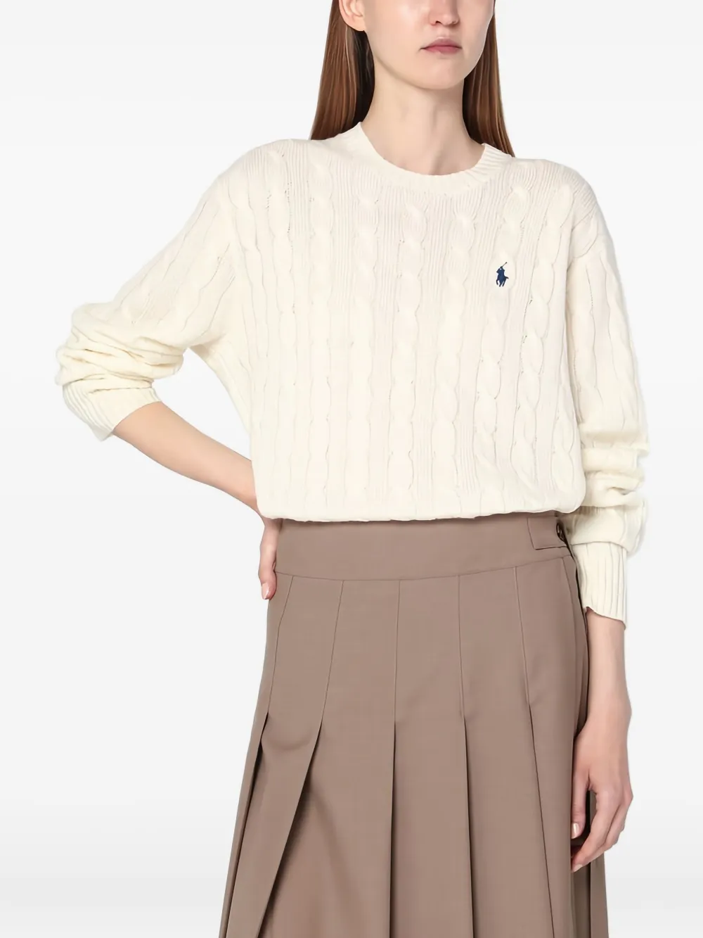 Tan sweater worn by a person, showing the sweater fit