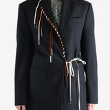 Navy coat worn by a person, showing the coat's fit