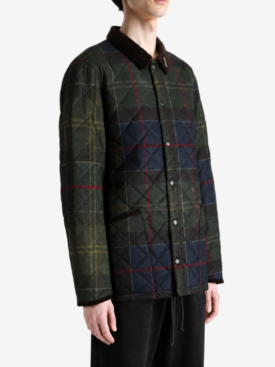 Green jacket worn by a person, showing the jacket fit