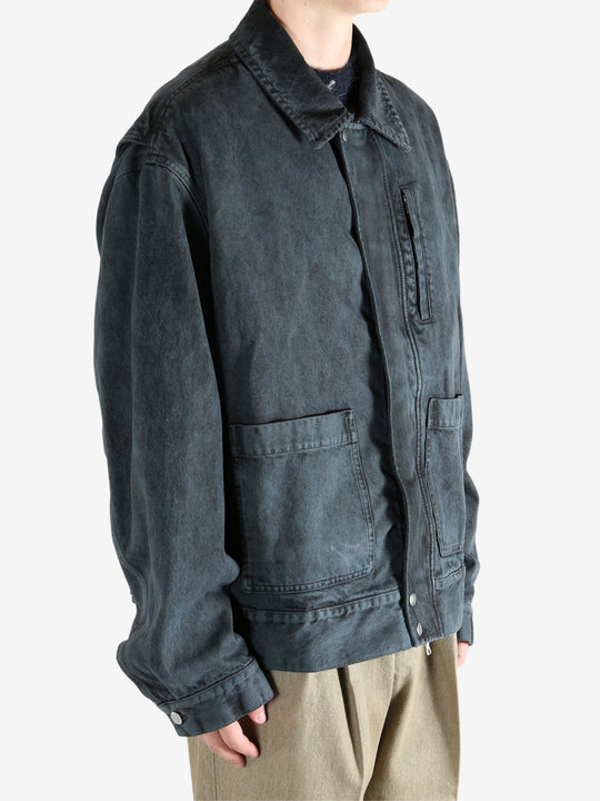 Blue jacket worn by a person, showing the jacket's fit